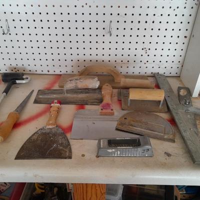 Assortment of trowels and other hand tools