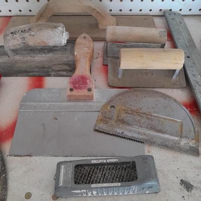Assortment of trowels and other hand tools