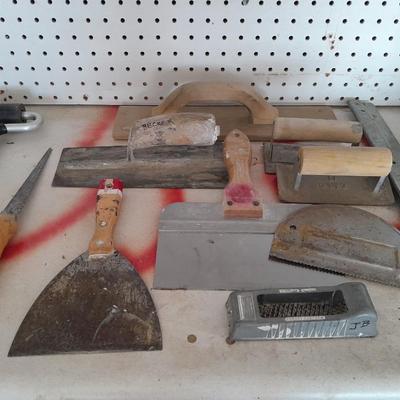 Assortment of trowels and other hand tools