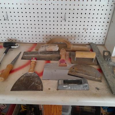 Assortment of trowels and other hand tools