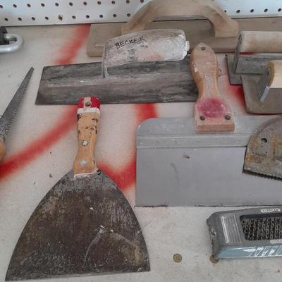 Assortment of trowels and other hand tools