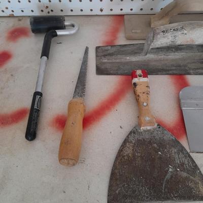 Assortment of trowels and other hand tools