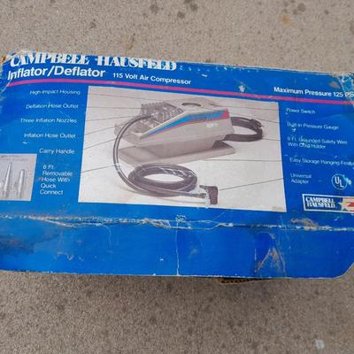 Campbell Hausfeld Inflater / decompressor 115 volt air compressor and a deluxe tire locking chock
