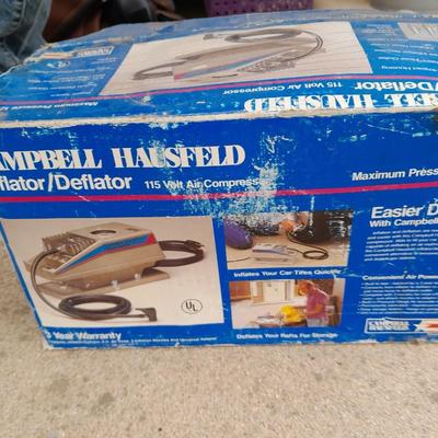 Campbell Hausfeld Inflater / decompressor 115 volt air compressor and a deluxe tire locking chock