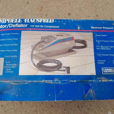 Campbell Hausfeld Inflater / decompressor 115 volt air compressor and a deluxe tire locking chock
