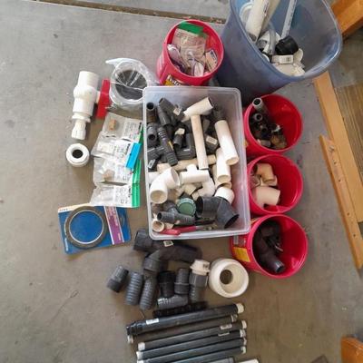 Variety of Plumbing PVC fittings and plastic threaded pipe