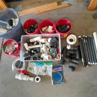 Variety of Plumbing PVC fittings and plastic threaded pipe