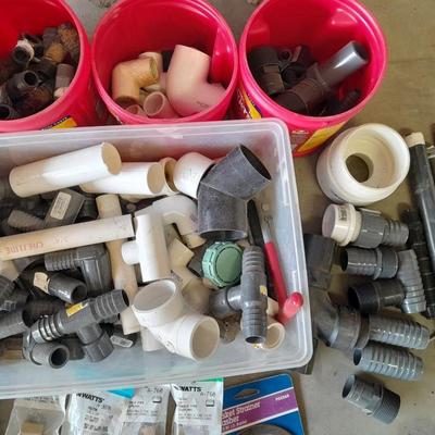Variety of Plumbing PVC fittings and plastic threaded pipe