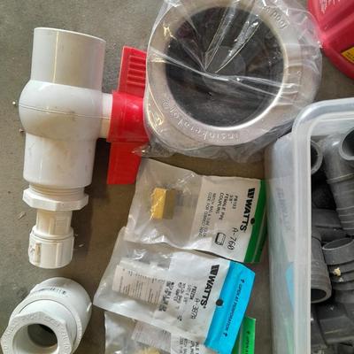 Variety of Plumbing PVC fittings and plastic threaded pipe