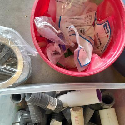 Variety of Plumbing PVC fittings and plastic threaded pipe