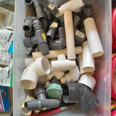 Variety of Plumbing PVC fittings and plastic threaded pipe