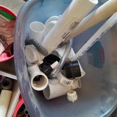 Variety of Plumbing PVC fittings and plastic threaded pipe