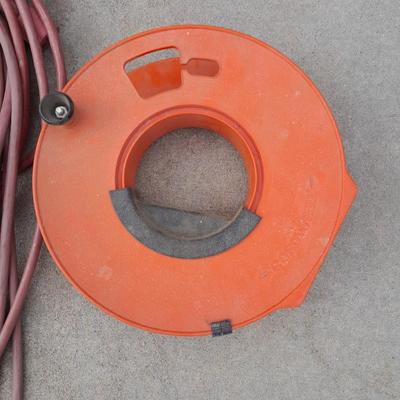 Red extension cord, and Extension cord organizing wheel