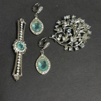Coro brooch and blue gem clip on earrings with matching pin