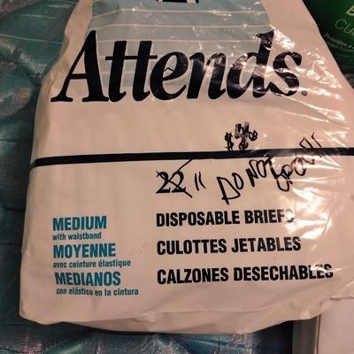 Seat cushion with disposable briefs (opened packages)