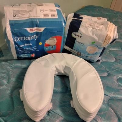 Seat cushion with adult incontinence pads (opened packages)