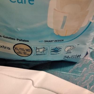 Seat cushion with adult incontinence pads (opened packages)