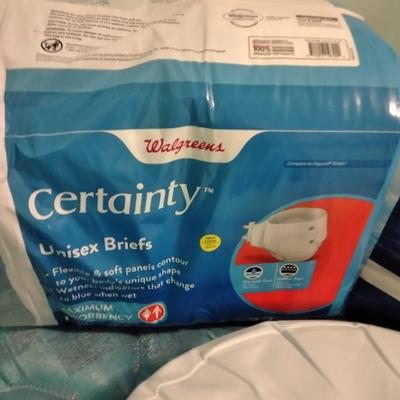 Seat cushion with adult incontinence pads (opened packages)