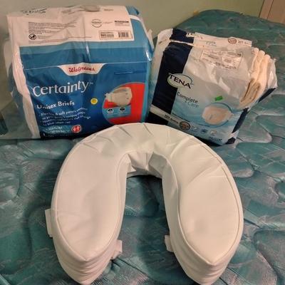 Seat cushion with adult incontinence pads (opened packages)