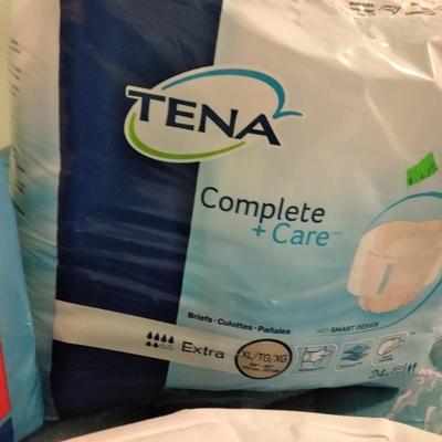 Seat cushion with adult incontinence pads (opened packages)