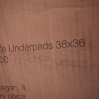 Large open box of Underpads Works great for puppy pads as well