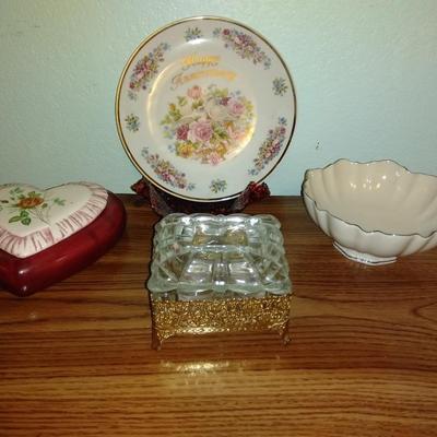 Filigree covered glass jewelry box, porcelain lidded heart dish, and decorative plate.