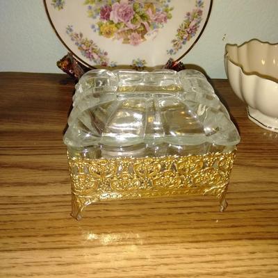 Filigree covered glass jewelry box, porcelain lidded heart dish, and decorative plate.