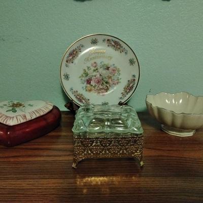 Filigree covered glass jewelry box, porcelain lidded heart dish, and decorative plate.