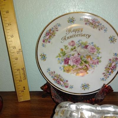 Filigree covered glass jewelry box, porcelain lidded heart dish, and decorative plate.