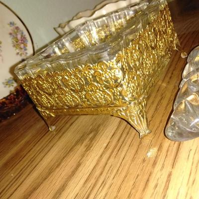 Filigree covered glass jewelry box, porcelain lidded heart dish, and decorative plate.