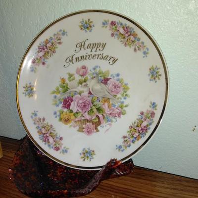 Filigree covered glass jewelry box, porcelain lidded heart dish, and decorative plate.