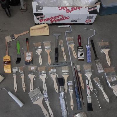 Painter's plastic and SO MANY paint / stain brushes!