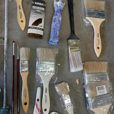 Painter's plastic and SO MANY paint / stain brushes!
