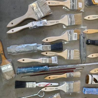 Painter's plastic and SO MANY paint / stain brushes!