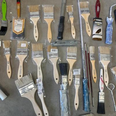 Painter's plastic and SO MANY paint / stain brushes!