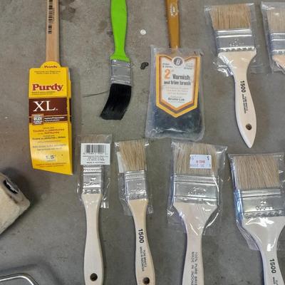 Painter's plastic and SO MANY paint / stain brushes!