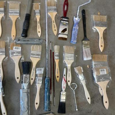 Painter's plastic and SO MANY paint / stain brushes!