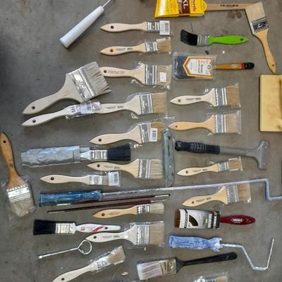 Painter's plastic and SO MANY paint / stain brushes!