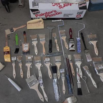 Painter's plastic and SO MANY paint / stain brushes!