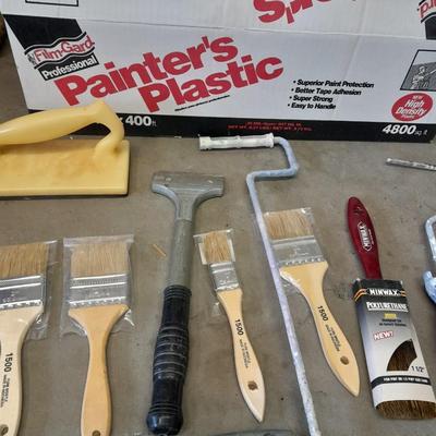 Painter's plastic and SO MANY paint / stain brushes!