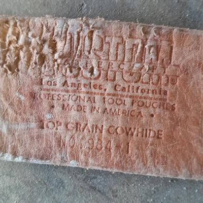 Canvas tool belt and Leather tool belt with saw, hammer, and claw