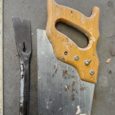 Two clamps, hand saw, claw bar, and a large ruler