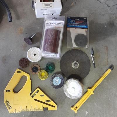 Assortment of wire and buffing wheels, sandpapers, and small tools