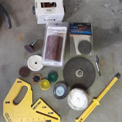 Assortment of wire and buffing wheels, sandpapers, and small tools