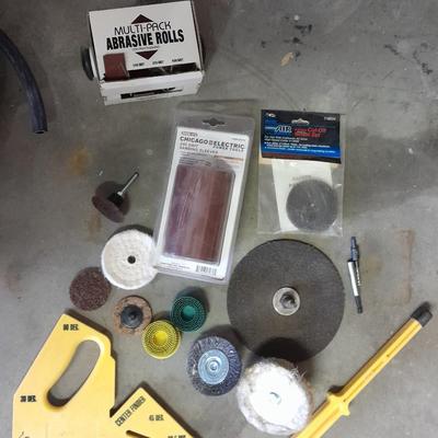 Assortment of wire and buffing wheels, sandpapers, and small tools