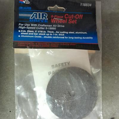 Assortment of wire and buffing wheels, sandpapers, and small tools