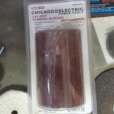 Assortment of wire and buffing wheels, sandpapers, and small tools