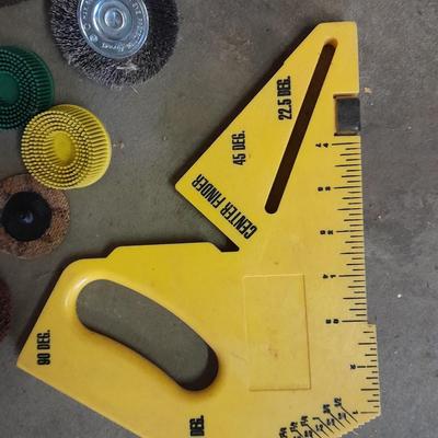 Assortment of wire and buffing wheels, sandpapers, and small tools