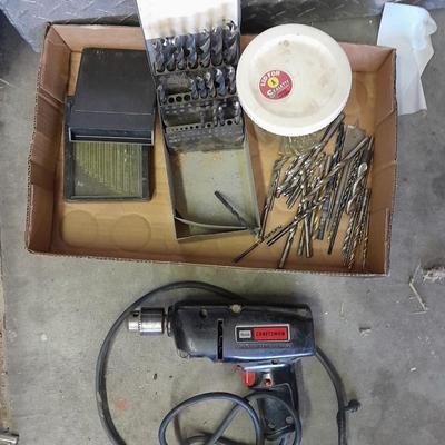3/8-inch electric drill with an assortment of drill bits