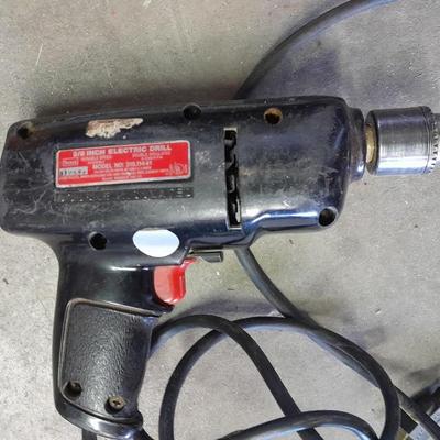 3/8-inch electric drill with an assortment of drill bits